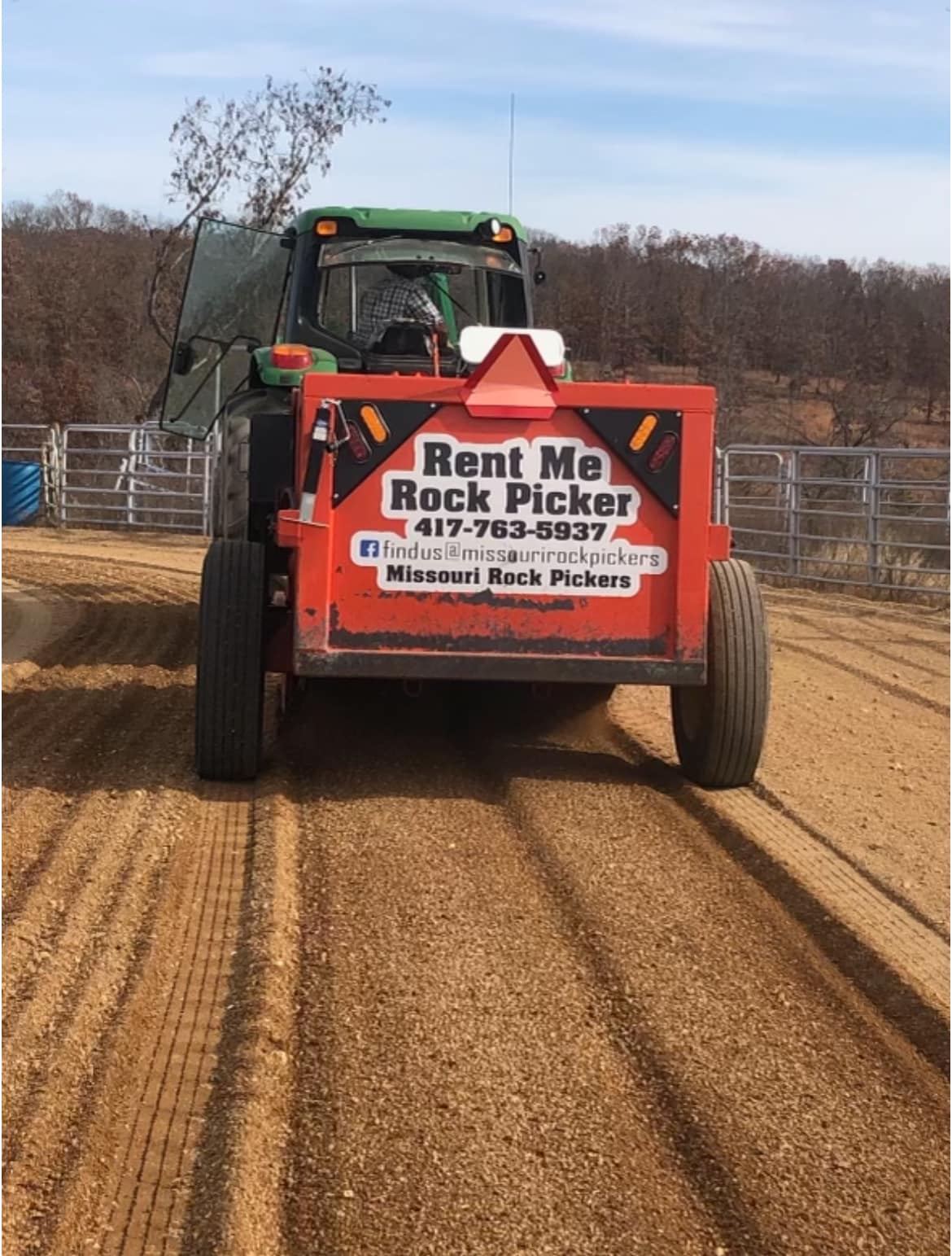 A rear view of the red machine being pulled by green tractor. A logo with text Rent Me Rock Picker
417-763-5937
Find us Facebook @missourirockpickers
Missouri Rock Pickers